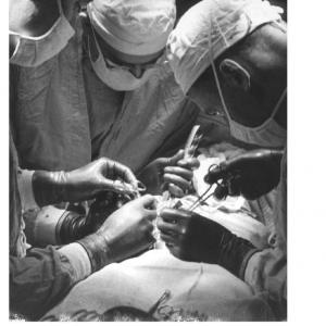 Surgeons during open hart surgery at Presbyterian Hospital, 1958