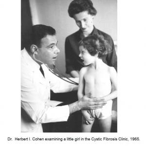 Dr. Cohen examining a little girl in the Cystic Fibrosis Clinic, 1965