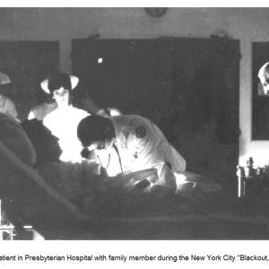 Patient in Presbyterian Hospital with family member during the New York City blackout, 1965