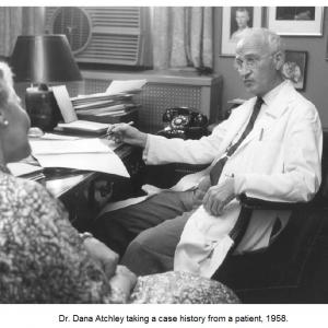 Dr. Atchley taking a case history from a patient, 1958