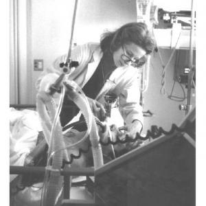 Dr. Garvey with a patient, 1990