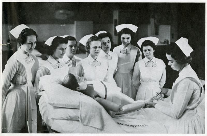 School of Nursing instructor Florence Vanderbilt (right) teaching students, 1930s